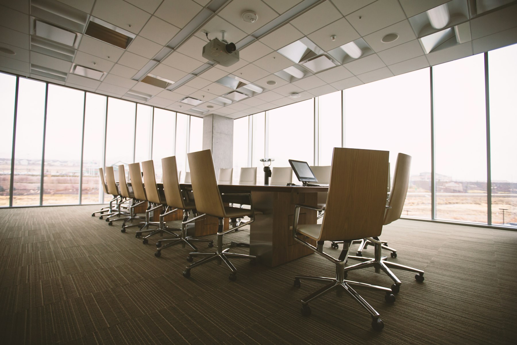 An empty boardroom, chairs waiting